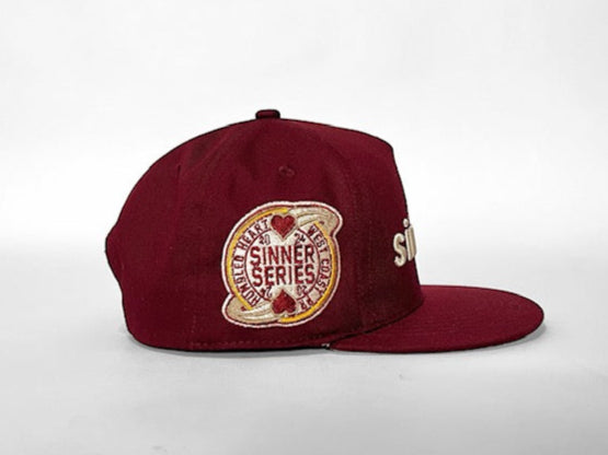 the sinners cabernet cap